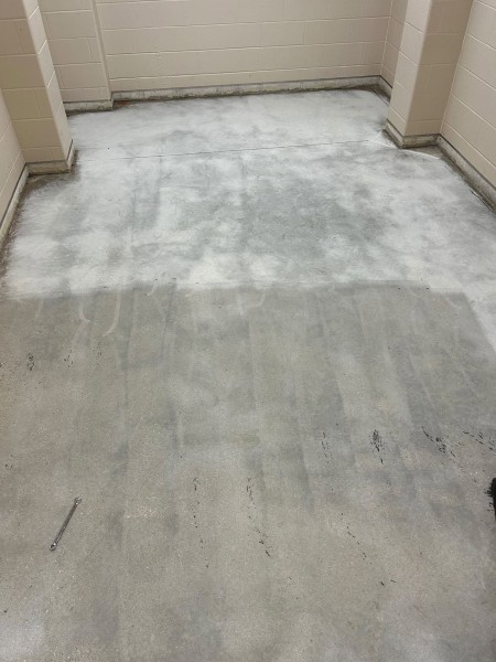 a concrete floor with a rough finish in one section